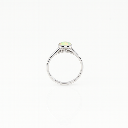 Ethiopian Opal women’s ring showcasing full fire and vibrant rainbow play-of-color, set in elegant sterling silver. October birthstone jewelry symbolizing hope, creativity, and emotional balance — perfect gift for her on any occasion.