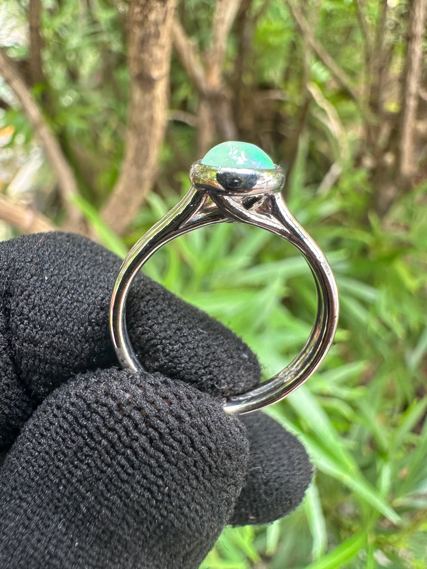 Ethiopian Opal women’s ring showcasing full fire and vibrant rainbow play-of-color, set in elegant sterling silver. October birthstone jewelry symbolizing hope, creativity, and emotional balance — perfect gift for her on any occasion.