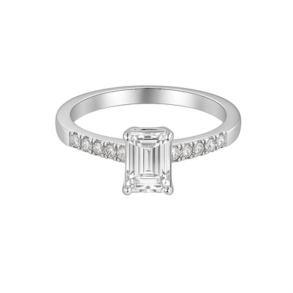 Silver ring with a rectangular diamond and smaller diamonds on a white background