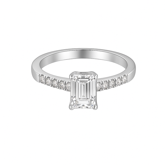 Silver ring with a rectangular diamond and smaller diamonds on a white background