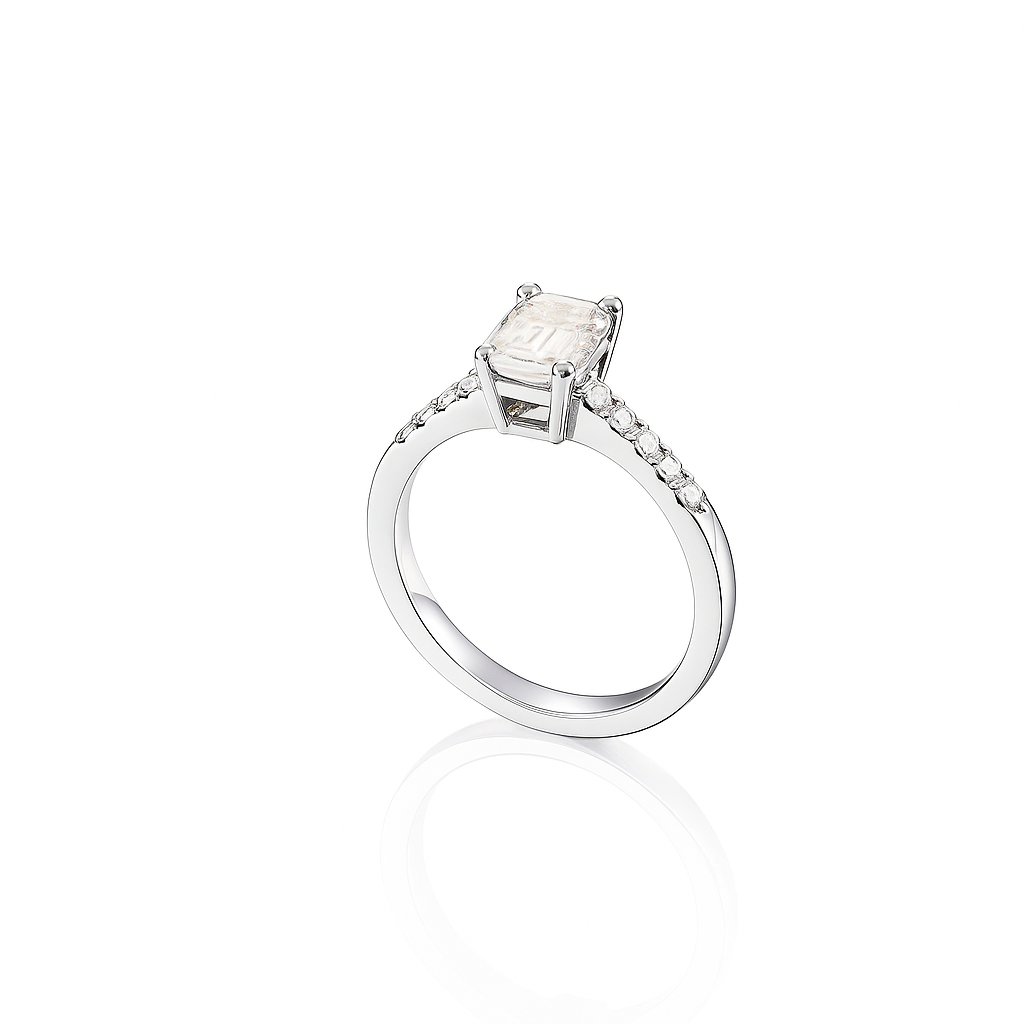 Elegant emerald-cut moissanite engagement ring in 925 sterling silver with pavé-set side stones. Features a brilliant D-color moissanite center stone offering diamond-like sparkle and clarity. Perfect as an engagement or anniversary ring, ethically crafted and ideal for everyday luxury wear