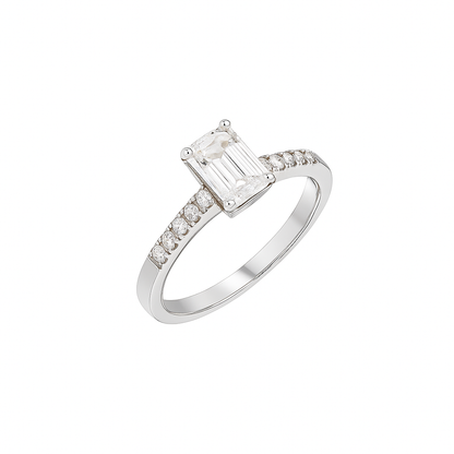 Elegant emerald-cut moissanite engagement ring in 925 sterling silver with pavé-set side stones. Features a brilliant D-color moissanite center stone offering diamond-like sparkle and clarity. Perfect as an engagement or anniversary ring, ethically crafted and ideal for everyday luxury wear