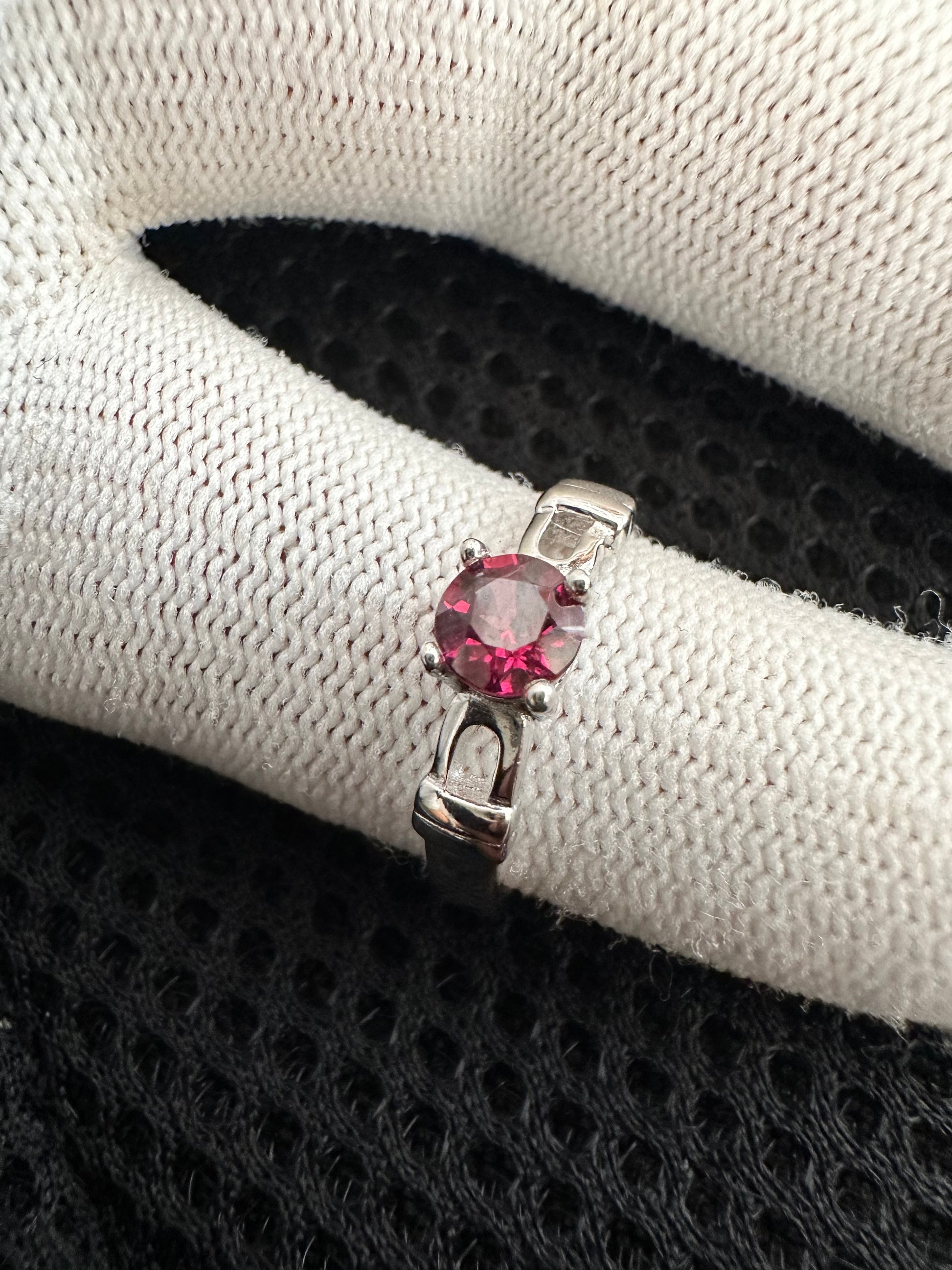 October's birthstone shines bright in this stunning silver ring with a Rubellite Tourmaline gemstone.